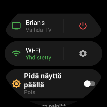 Kellon valikko, jossa aktiivinen TV on ylimpänä ja Vaihda TV -pikavalinta punaisen virtapainikkeen vieressä