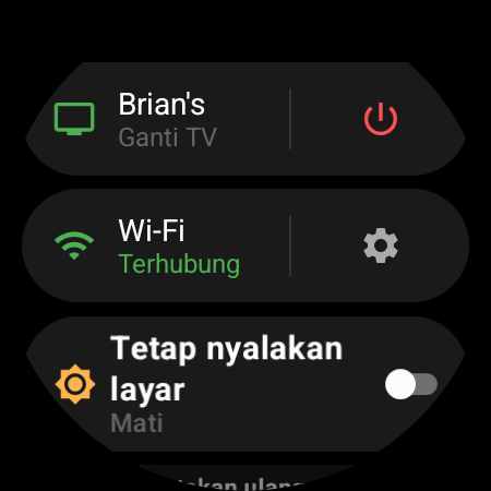 Menu jam tangan dengan TV aktif di bagian atas dan pintasan “Ganti TV” di samping tombol daya merah